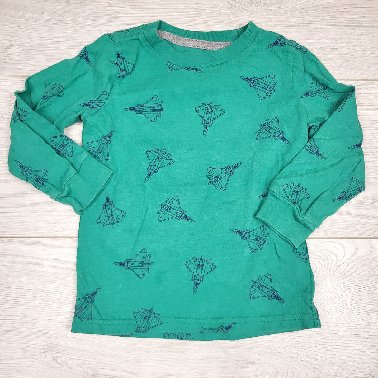 SMRSH1 - Simple Joys green long sleeved top with fighter jets. Size 2T