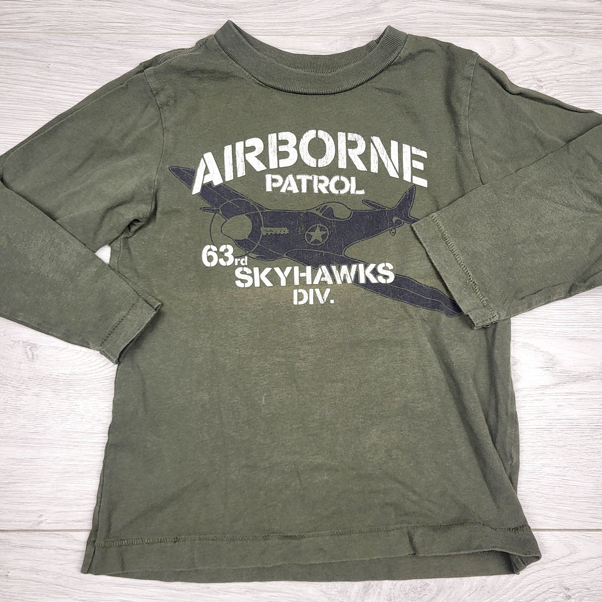 RGRN22 - Children's Place green "Airborne Patrol" long sleeved top. Size 4T