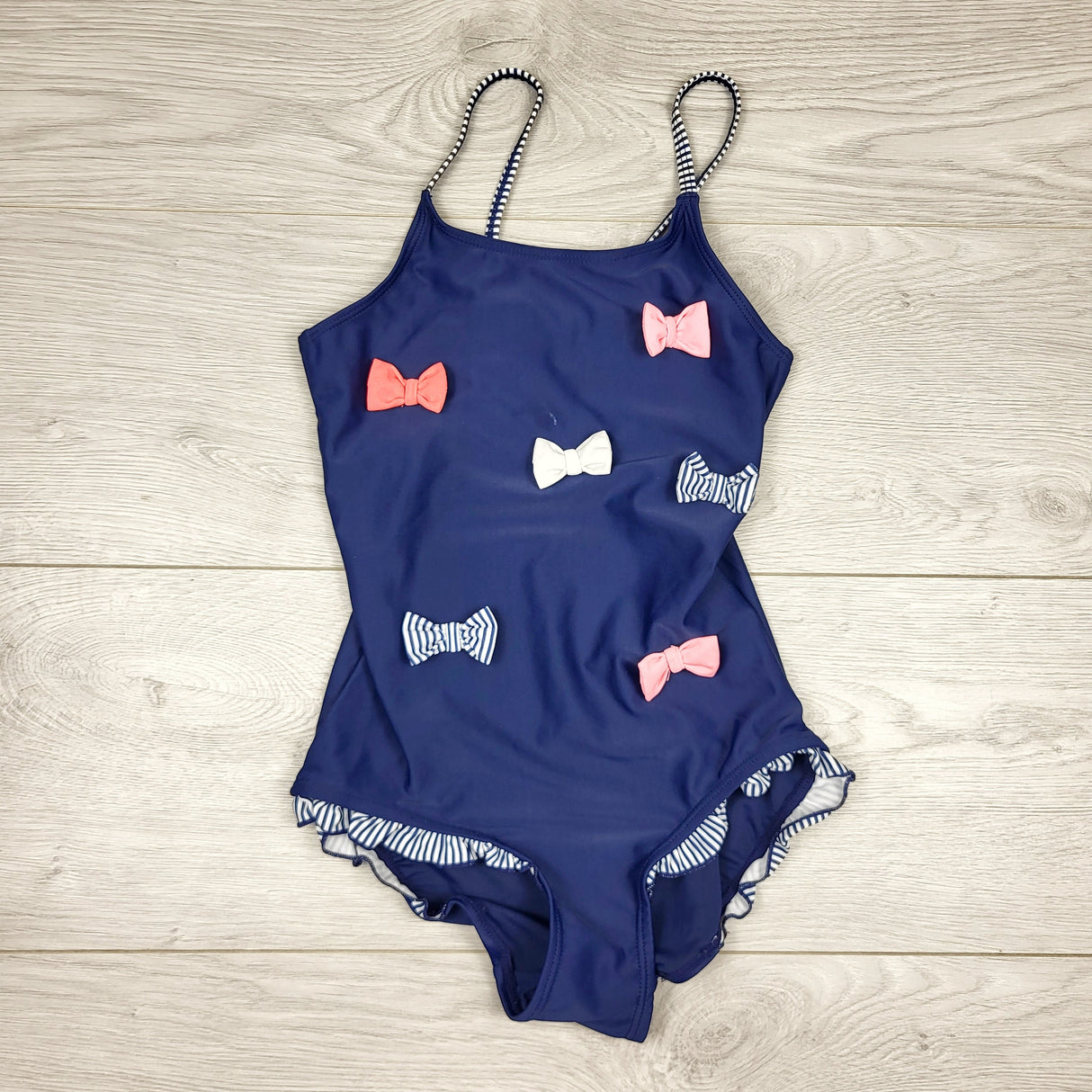 APPL1 - H and M navy one piece swimsuit with bows. Size 6-8 years