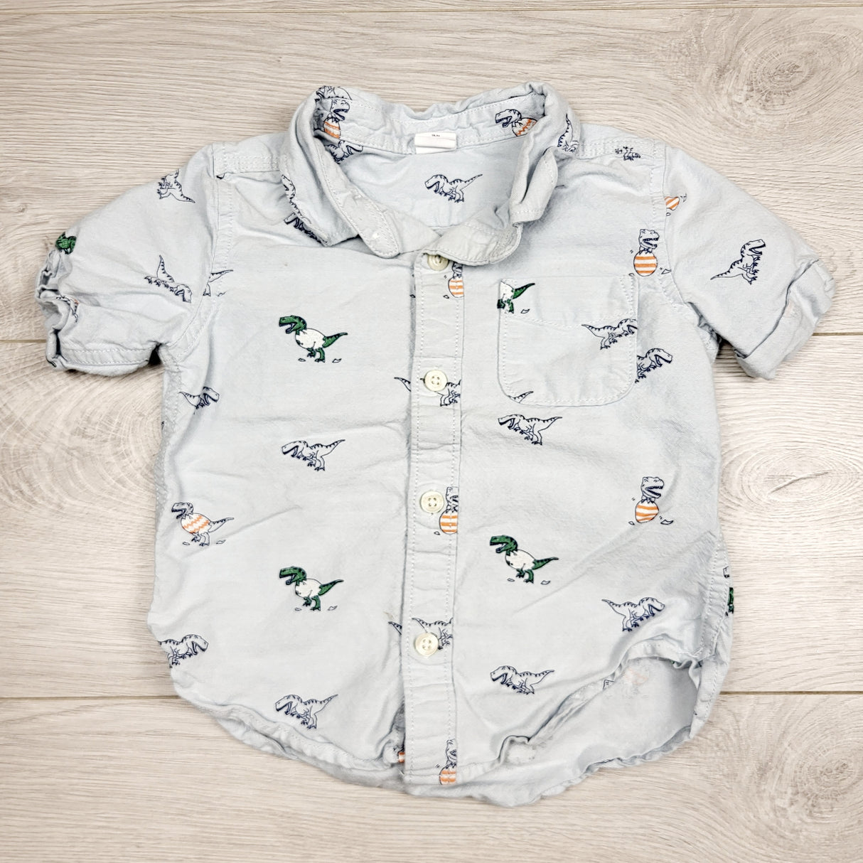 CHLV1 - Gap light blue button down shirt with dinosaurs. Size 18-24 months