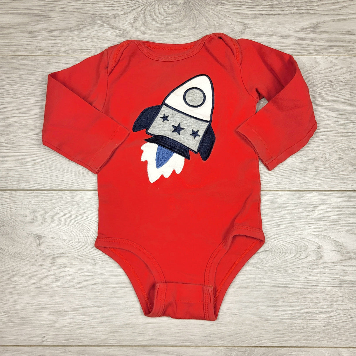 CHLV1 - Pekkle red bodysuit with rocket. Size 12 months