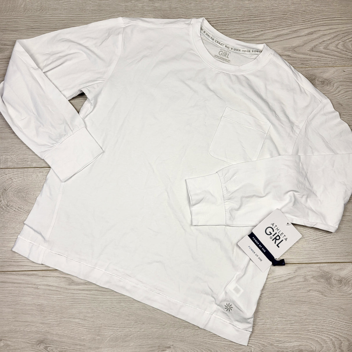 SHYS2 - NEW - Athleta Girl white long sleeved active top. Size 8-10 years