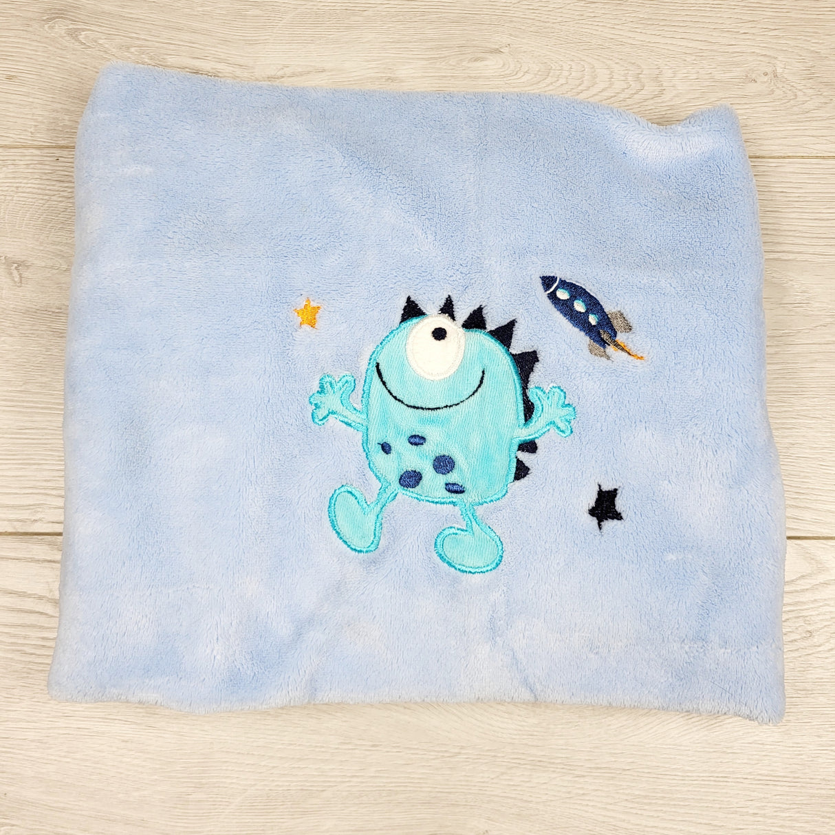 KARE1 - Blue plush baby blanket with monster.  Has minky backing