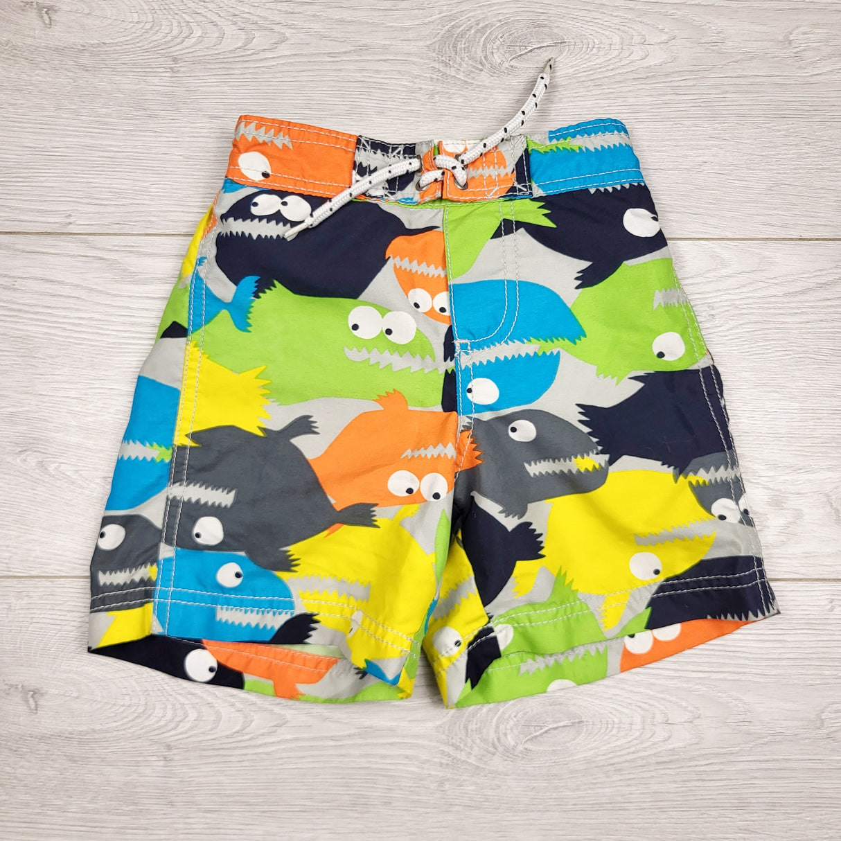 KARE2 - Carters mesh lined swim shorts with monsters. Size 2T