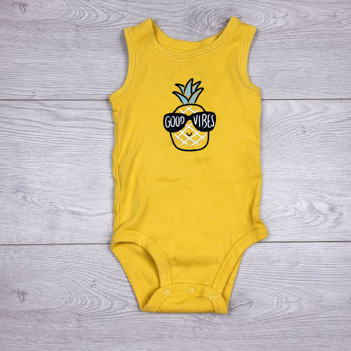 KARE22 - Carters yellow tank style bodysuit with pineapple. Size 6 months