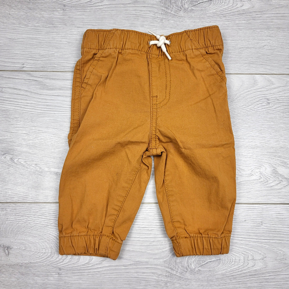 KARE22 - Children's Place tan pull on pants. Size 0-3 months