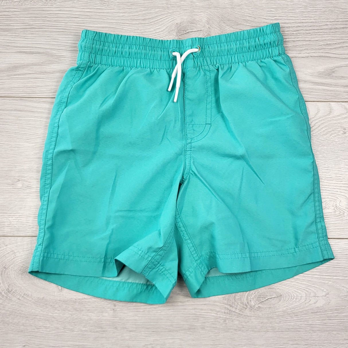 KHW1 - Old Navy turquoise mesh lined swim shorts. Size 8