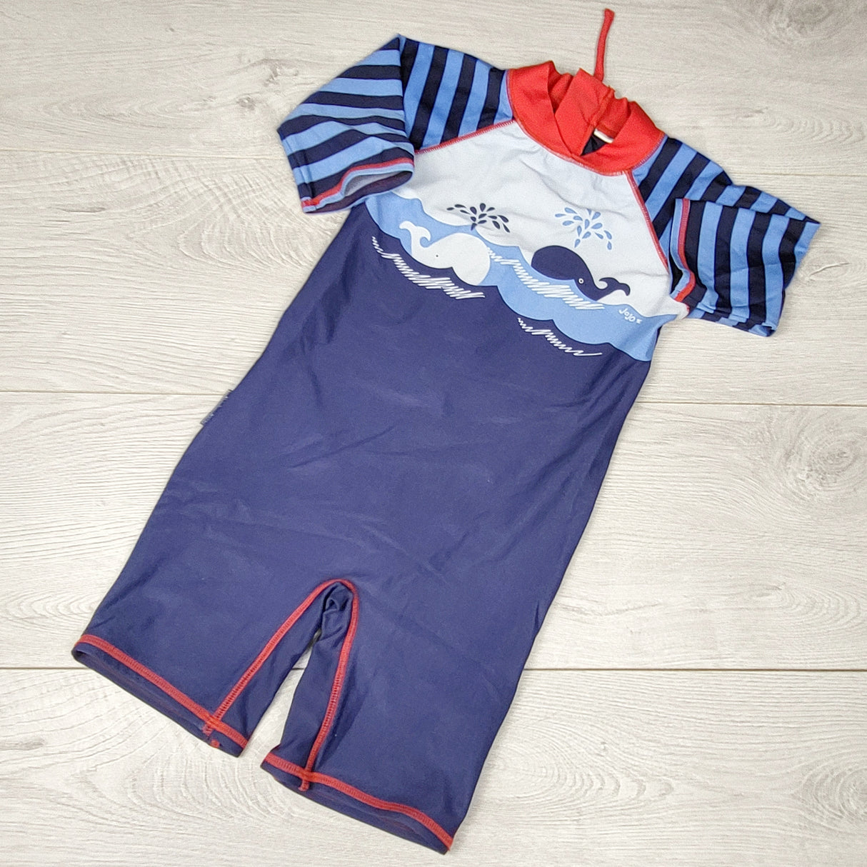 NTLL1 - Jojo Maman Bebe navy one piecerash guard with whales. Size 4/5T