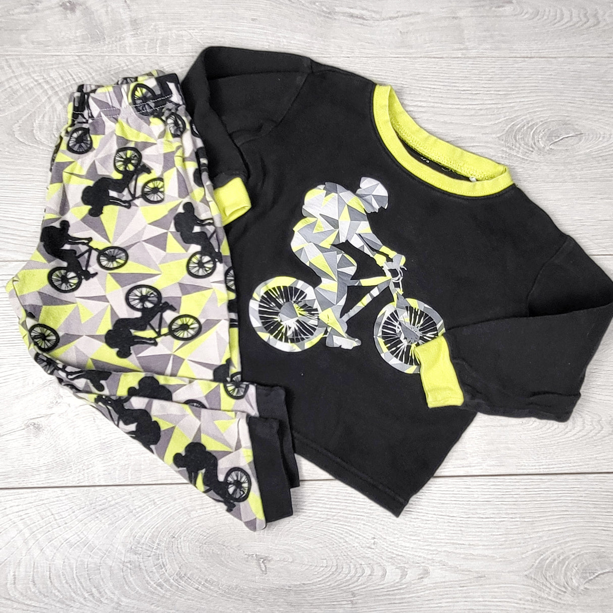 NTLL1 - Pekkle black 2pc cotton PJs with BMXer. Size 2/3T