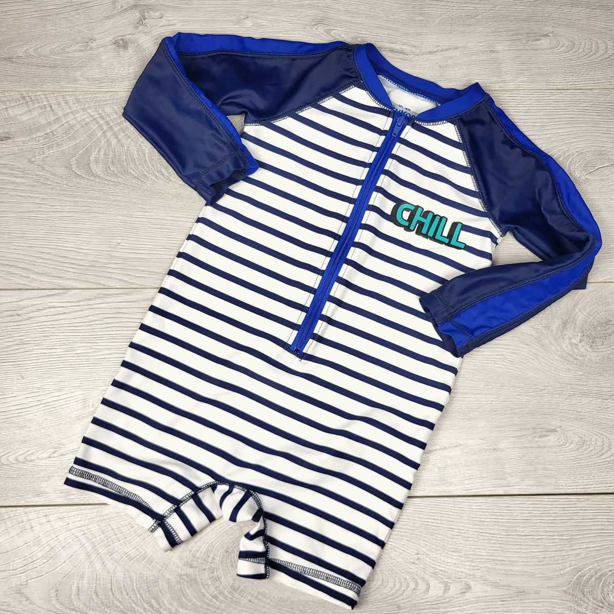 NTLL1 - Oshkosh navy striped long sleeved one piece rash guard. Size 18 months