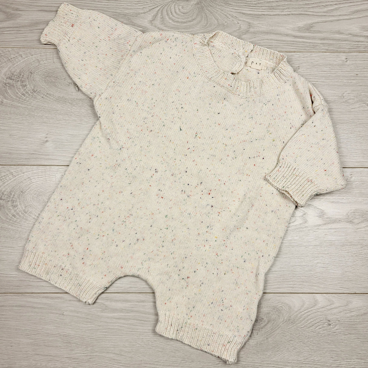 DMKY2 - Oat brand speckled sweater romper. Size 0-6 months