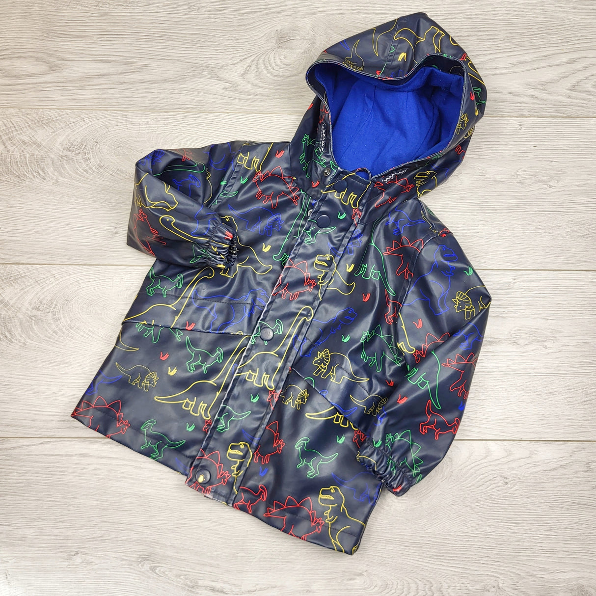 JLMB2 - George navy jersey lined rain jacket with dinosaurs. Size 2T