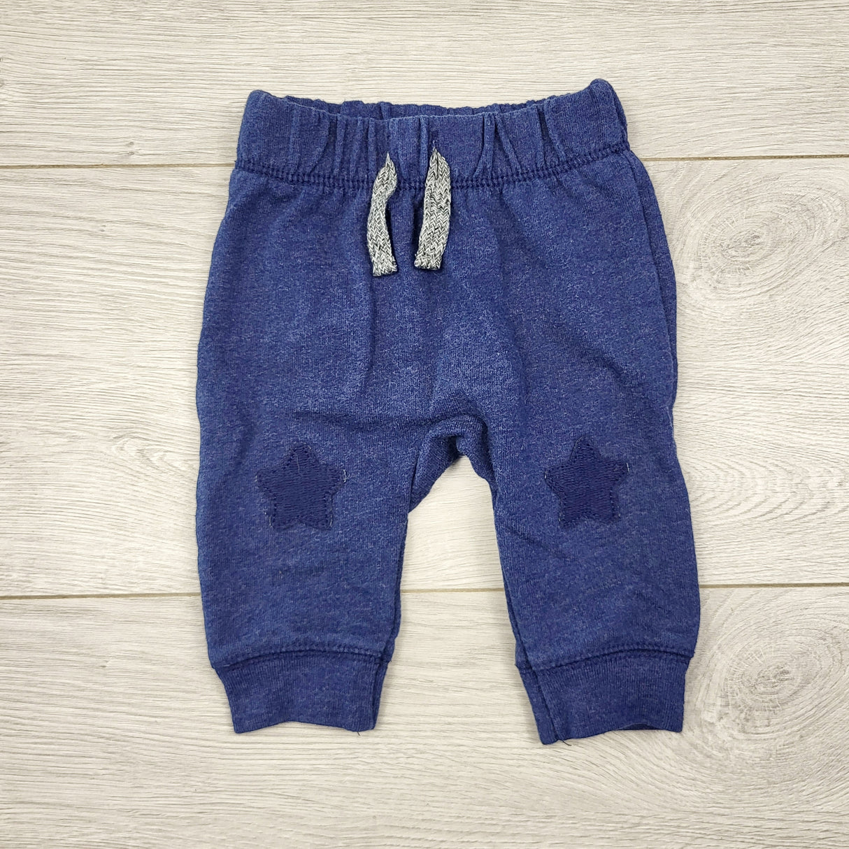 AALD1 - Cat and Jack blue cotton pants with star knee patches. Newborn size