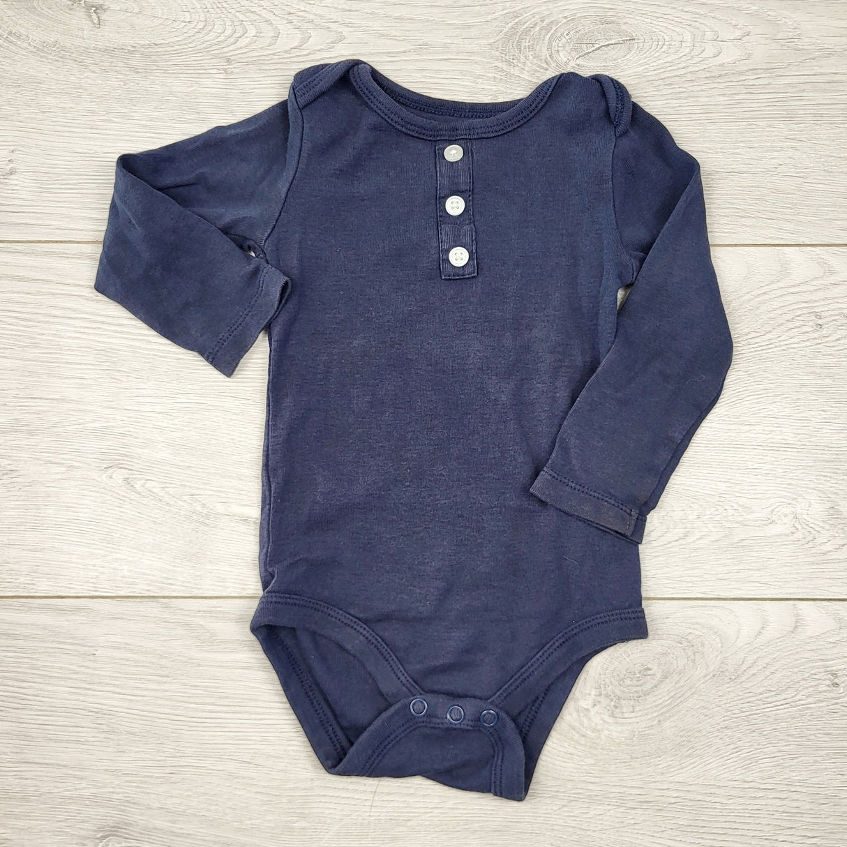 AALD1 - Joe navy long sleeved bodysuit with buttons. Size 6-12 months