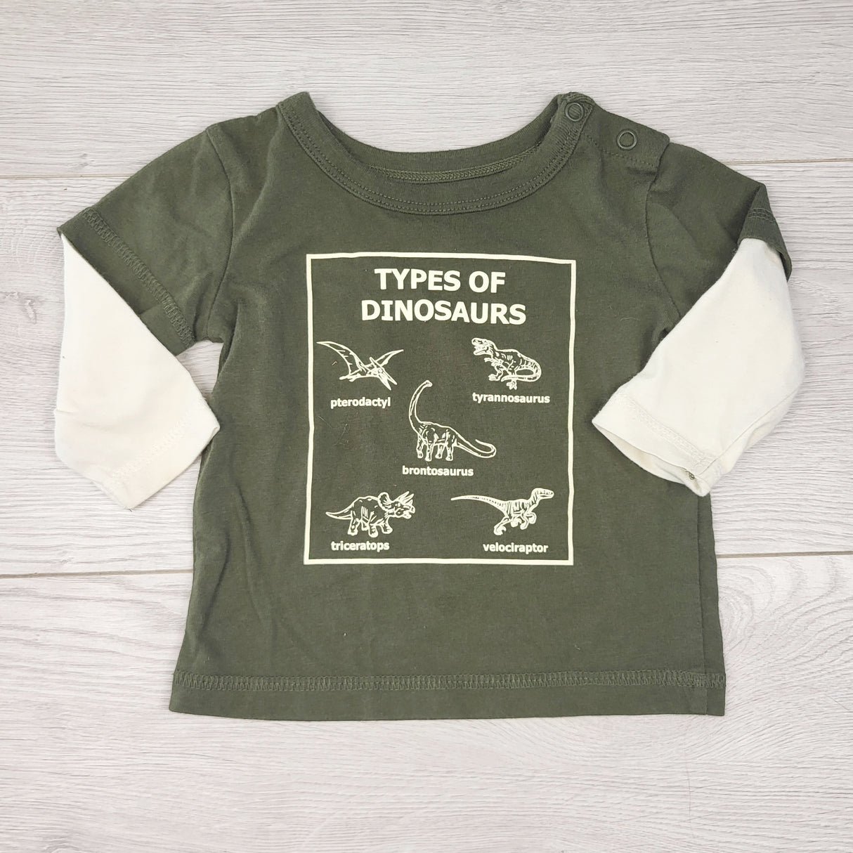 AALD11 - George green fooler shirt with dinosaurs. Size 3-6 months