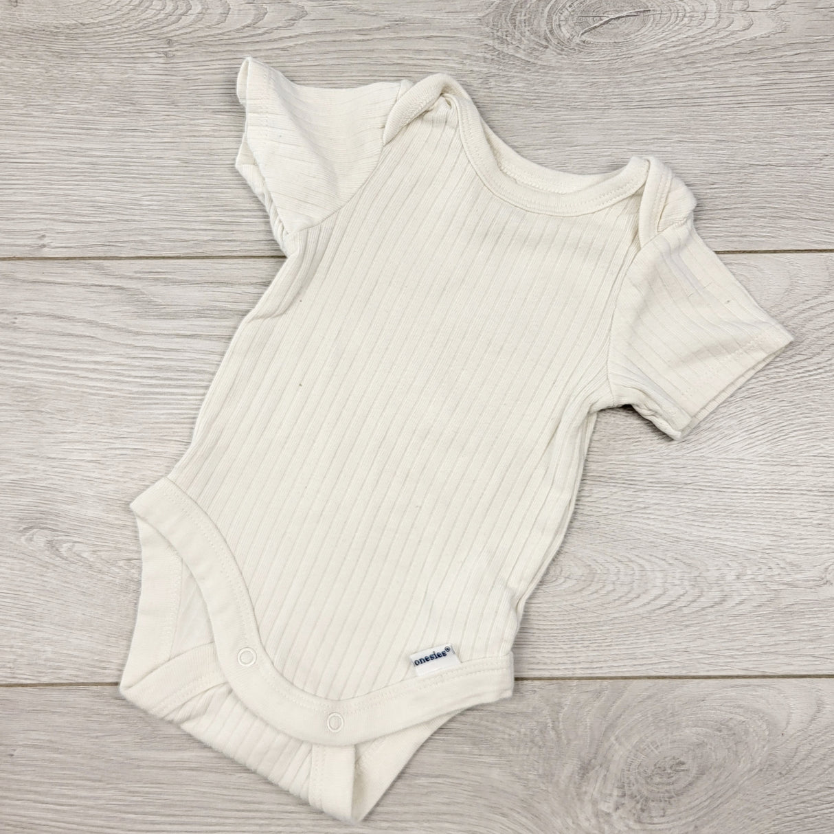 AALD11 - Modern Moments white ribbed bodysuit. Newborn size