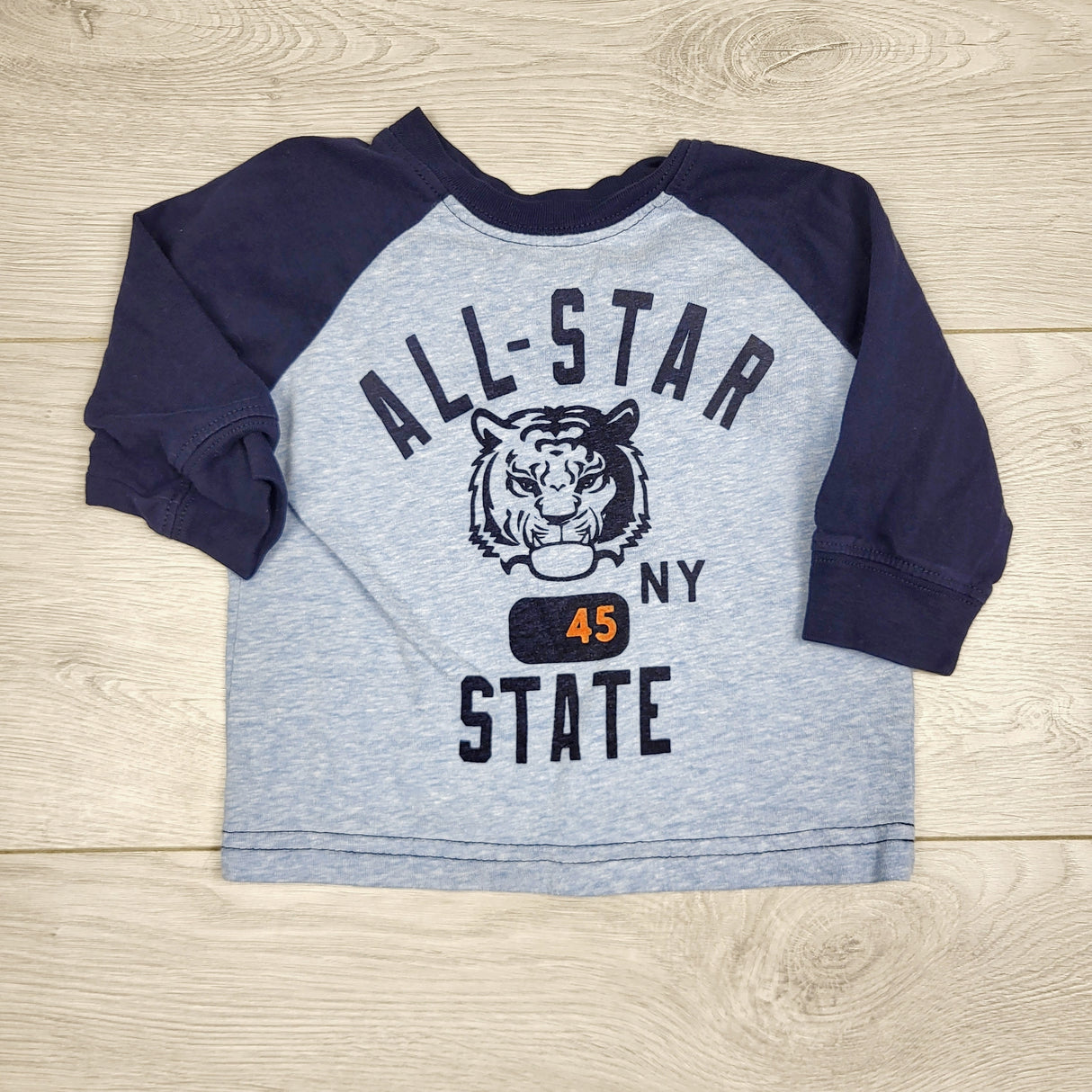 CCAM3 - Carters blue and navy raglan top with tiger. Size 6 months