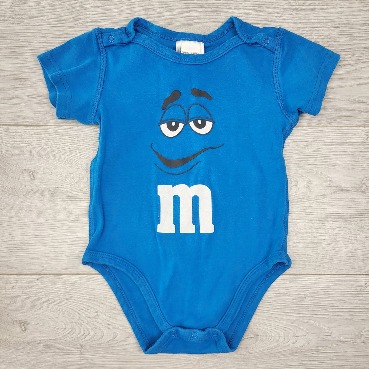 CTWN1 - M and M's blue bodysuit. Size 24 months