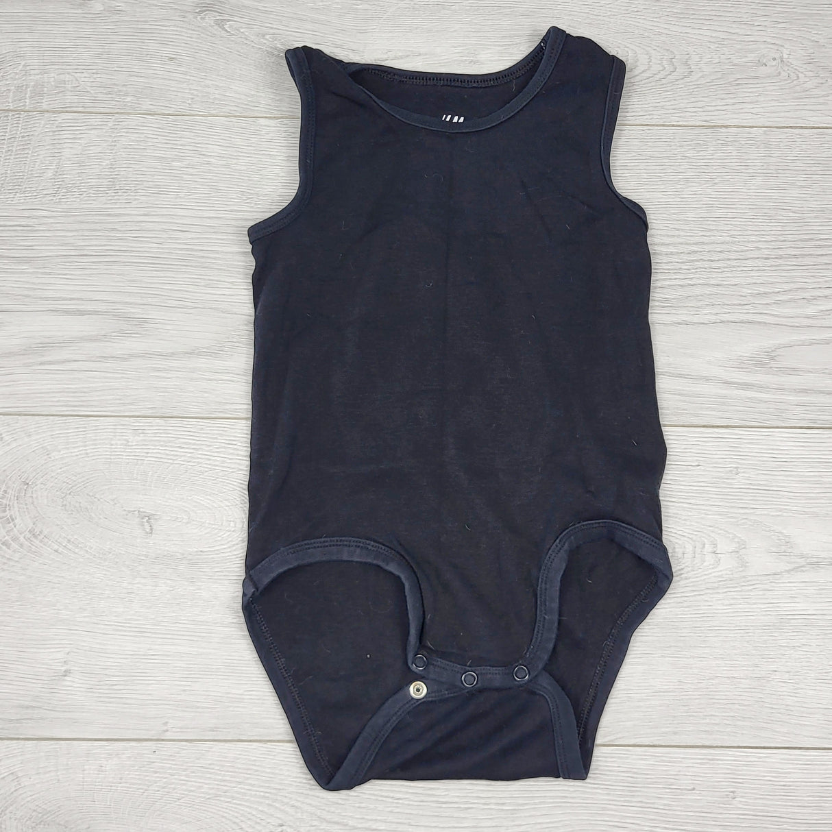 RBEN2 - H and M black organic cotton tank style bodysuit. Size 18-24 months