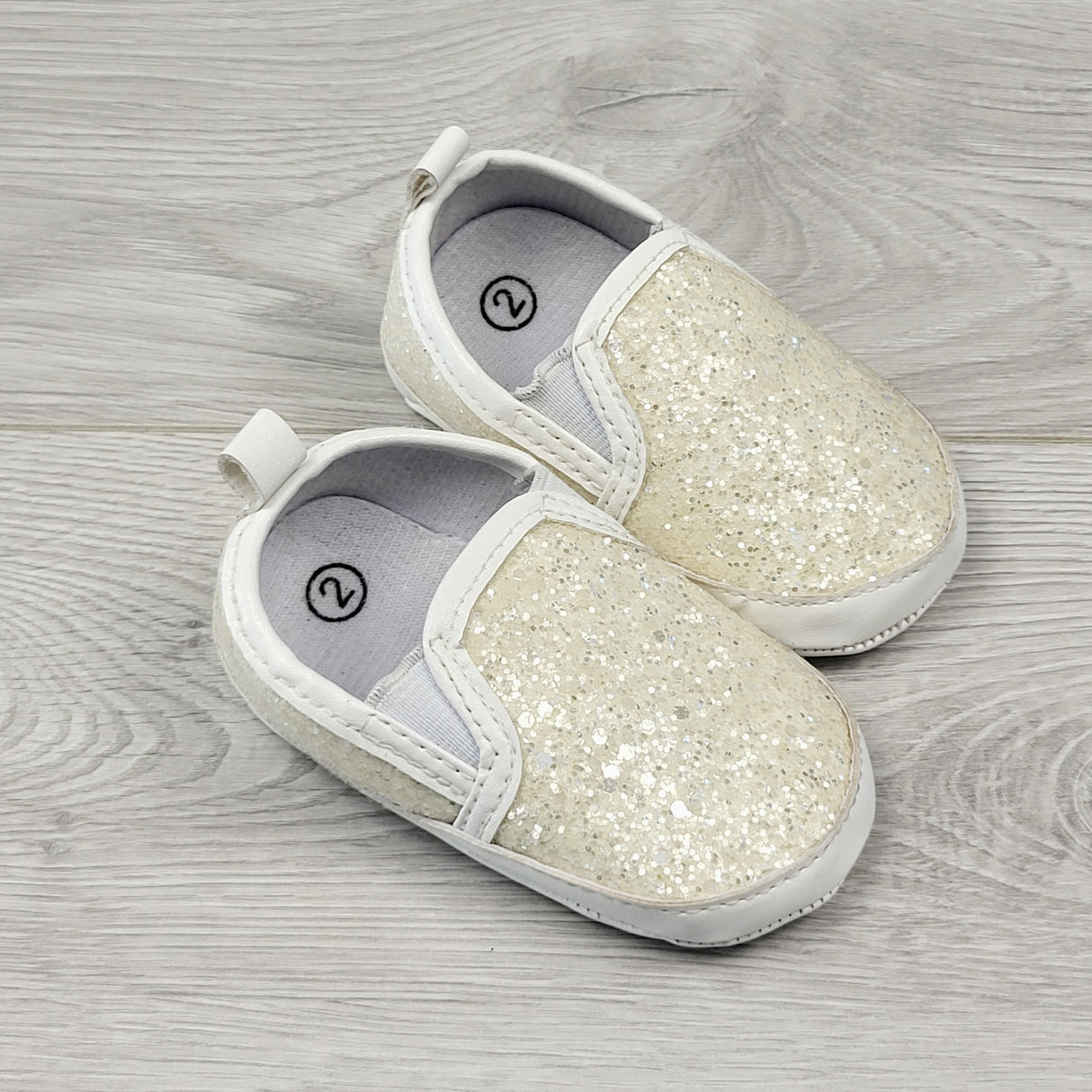 MBLK2 - White sparkle slip on soft soled shoes. Size 2