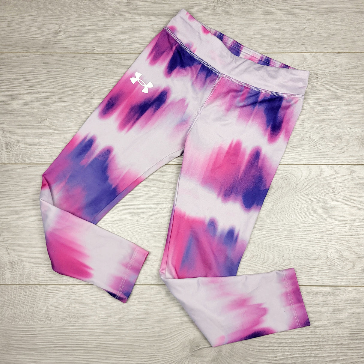 TSAM22 - Under Armour pink and purple patterned active leggings. Size 5T