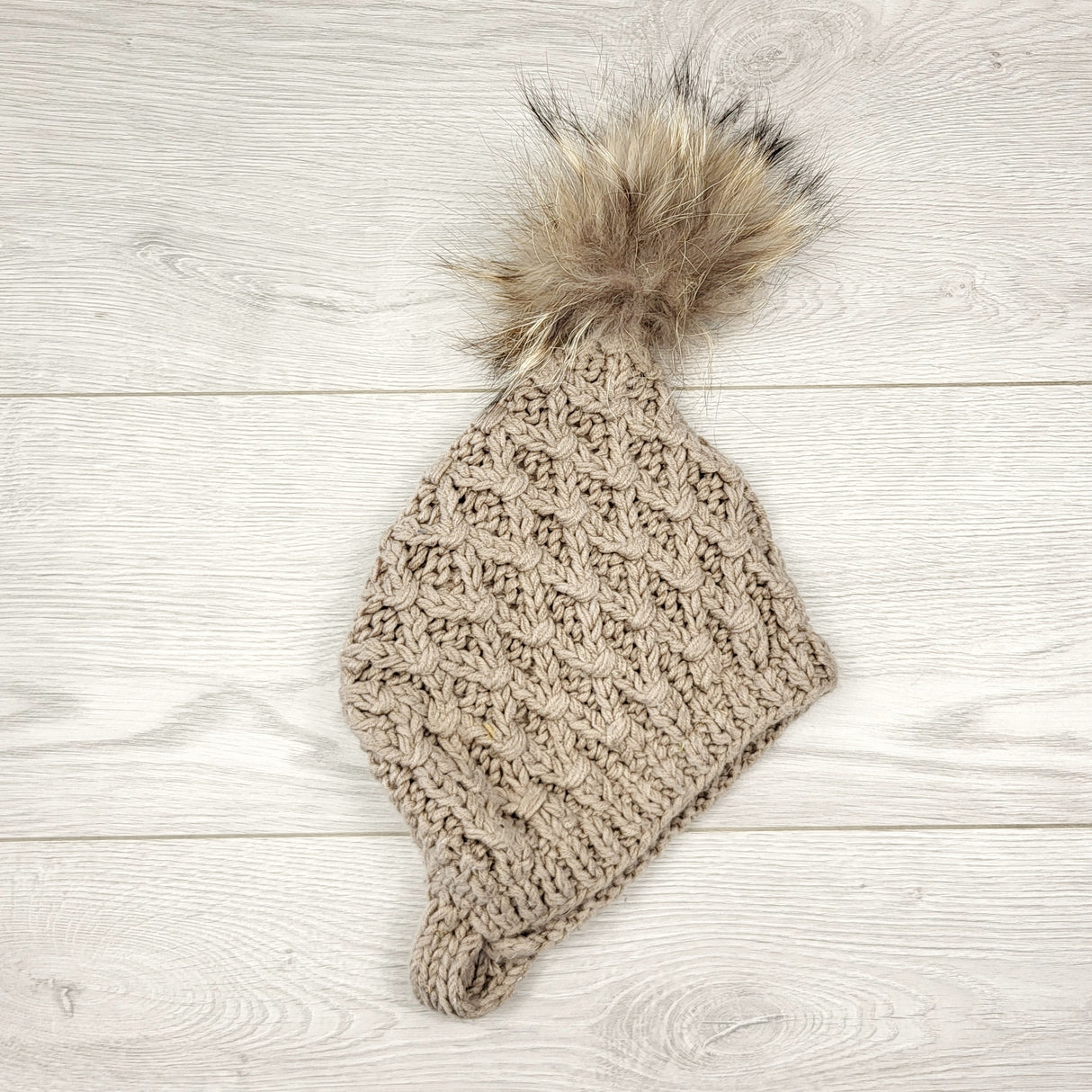 CCAM6 - Handmade knit hat with removable pom pom.  Approx 0-12 months