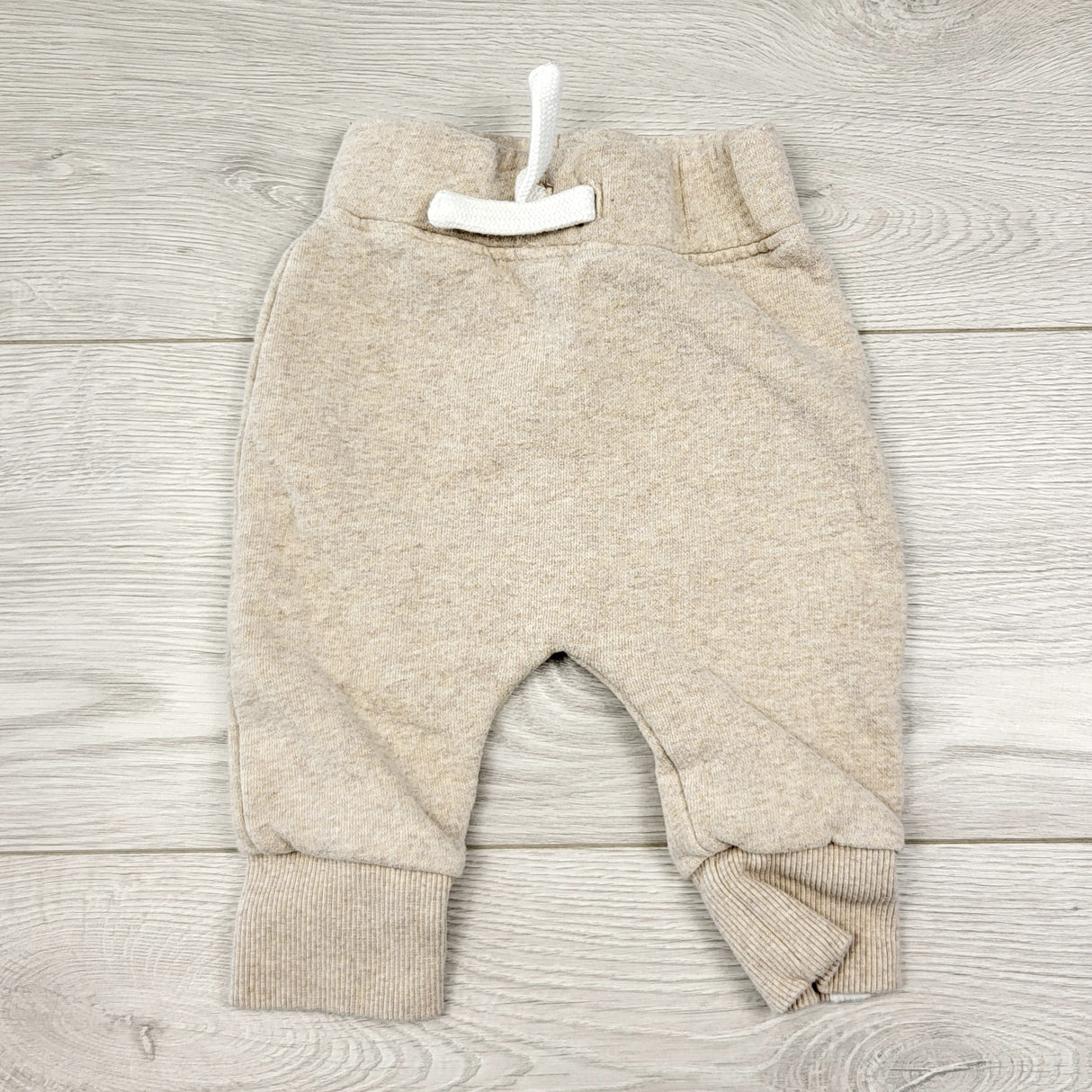 CCAM6 - Rise Little Earthling beige fleecy lined joggers. Size 3-6 months