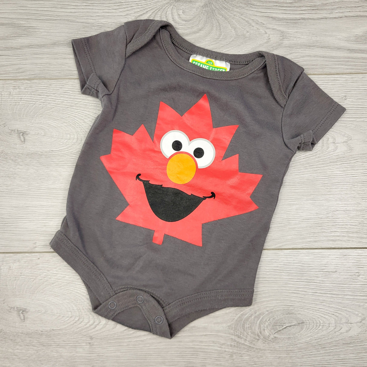 PRCH1 - Sesame Street grey Elmo bodysuit with maple leaf. Size 0-3 months