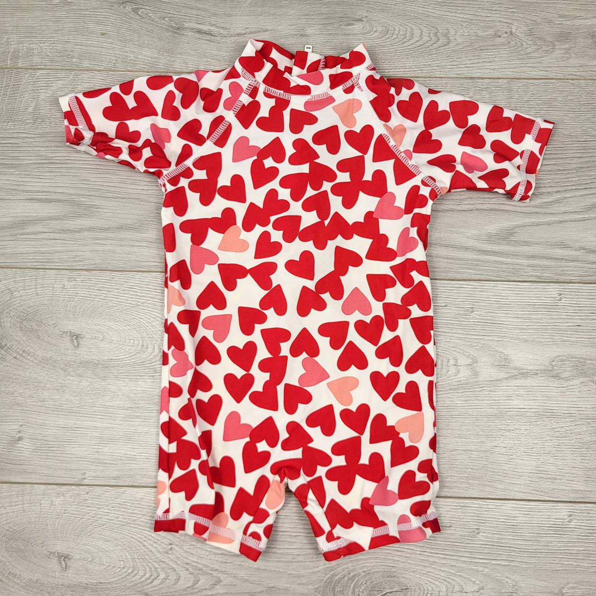 CTWN3 - Joe one piece rash guard with hearts. Size 6-12 months