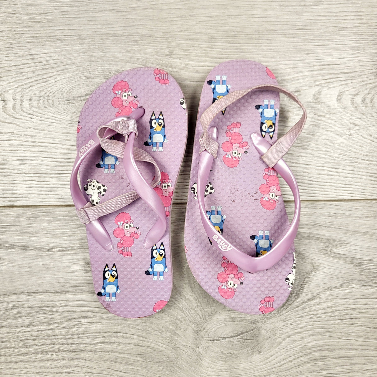 AWAT1 - Bluey purple flip flop sandals. Size 7