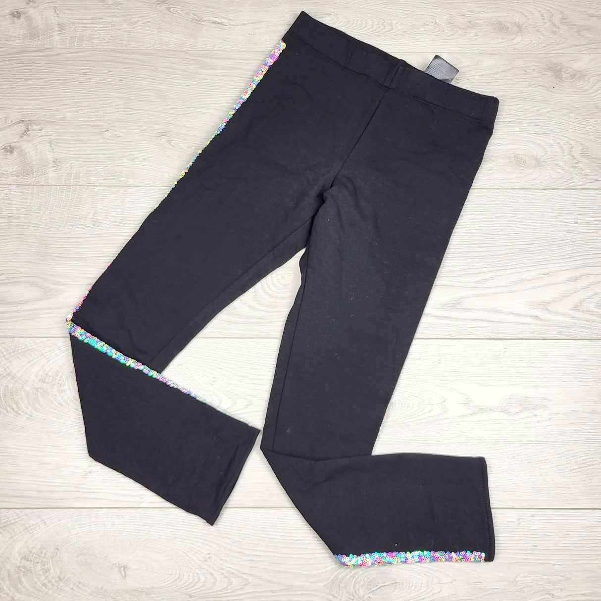 GFST1 - NEW - H and M black leggings with side sequins. Size 10