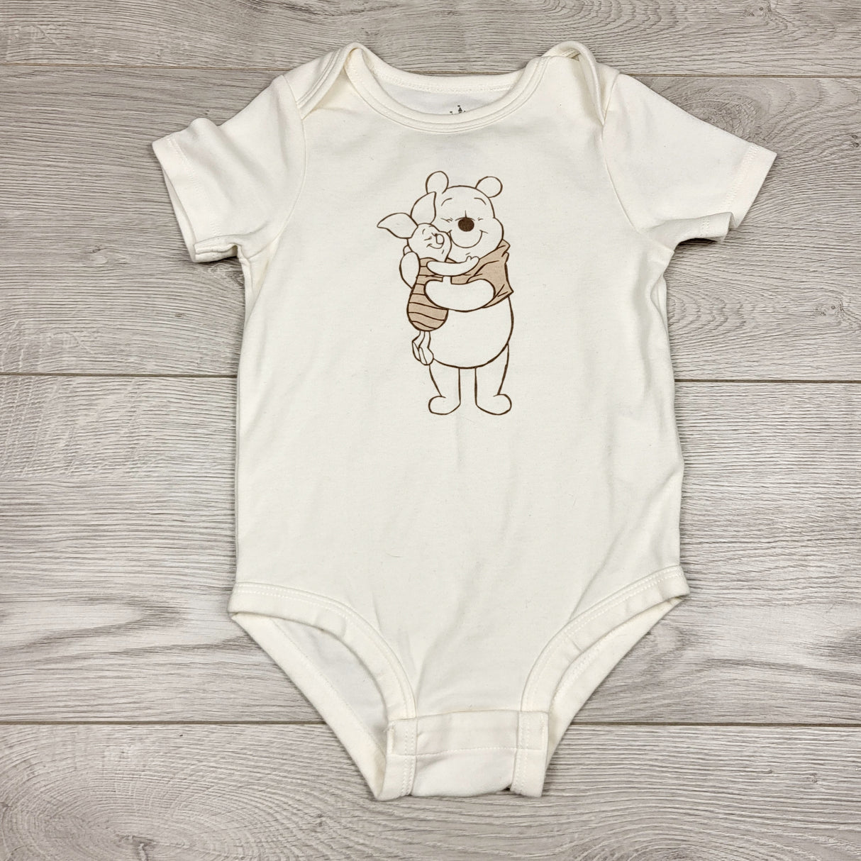 ALTO1 - Disney cream coloured Winnie the Pooh bodysuit. Size 24 months