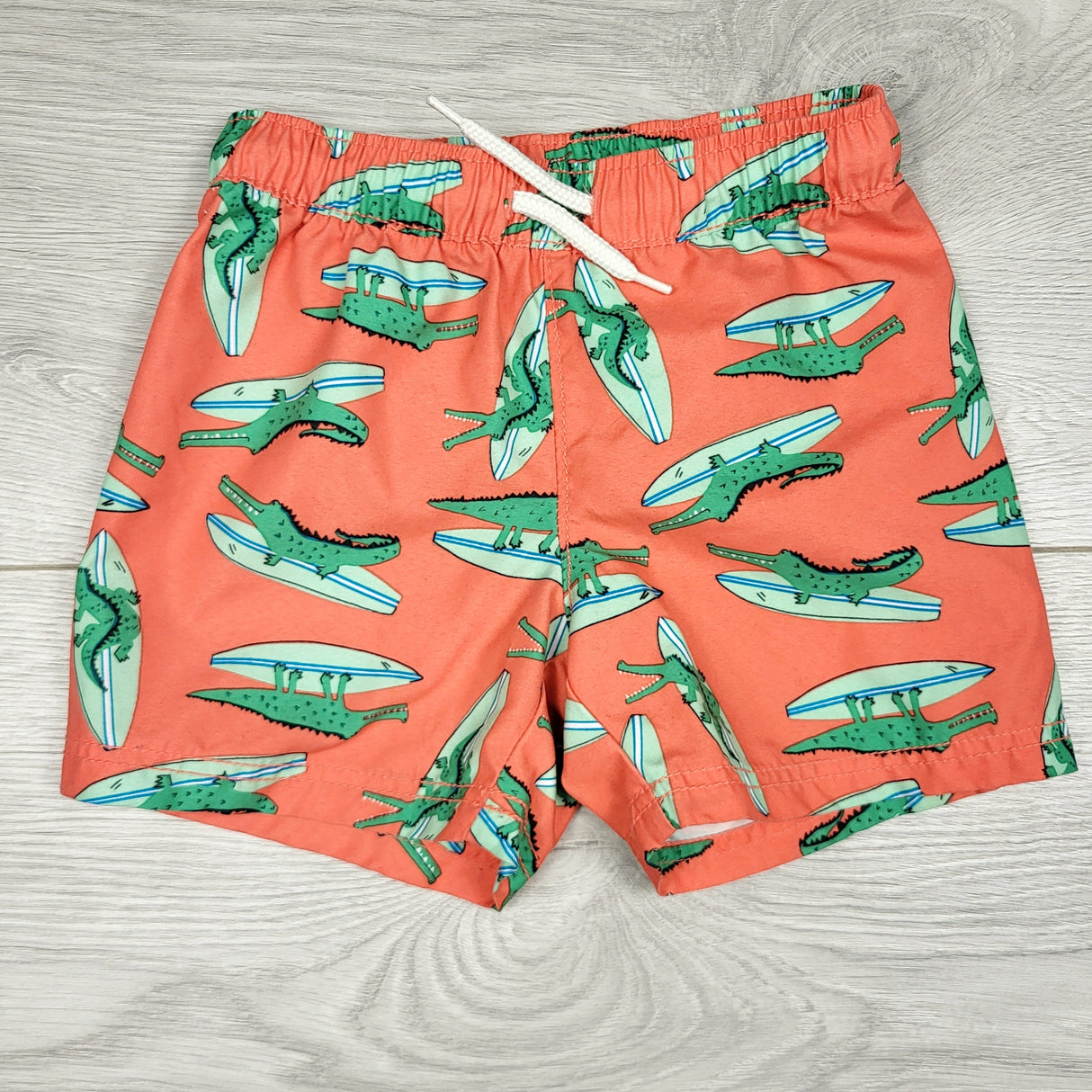 ALTO1 - Old Navy salmon coloured board shorts with alligators. Size 12-18 months