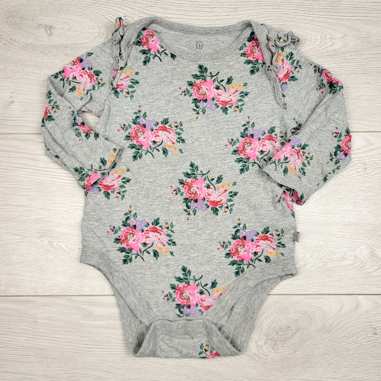 BBIN1 - Gap grey floral print long sleeved bodysuit. Size 6-12 months