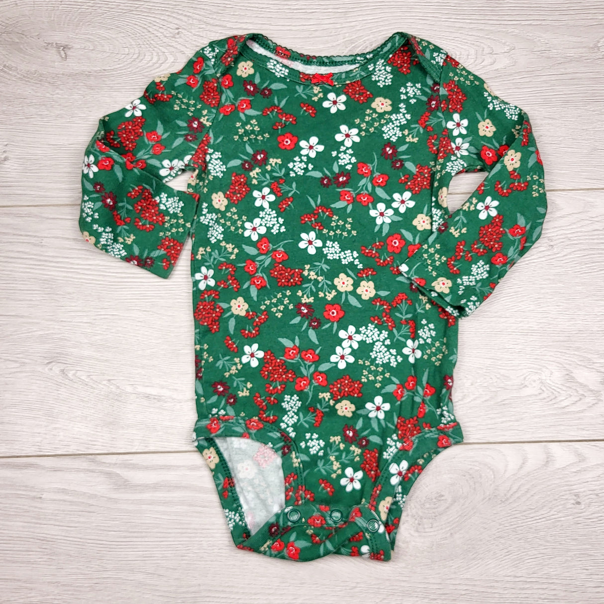 BBIN1 - Carters green floral print long sleeved bodysuit. Size 9 months