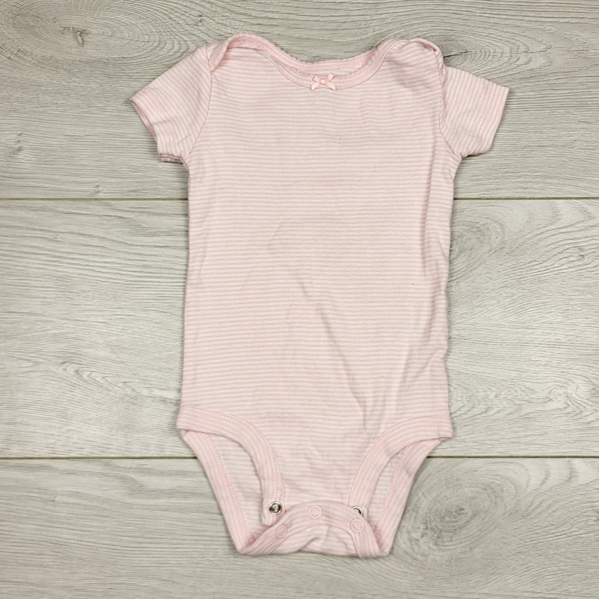 BBIN12 - Carters pink striped short sleeved bodysuit. Size 6 months