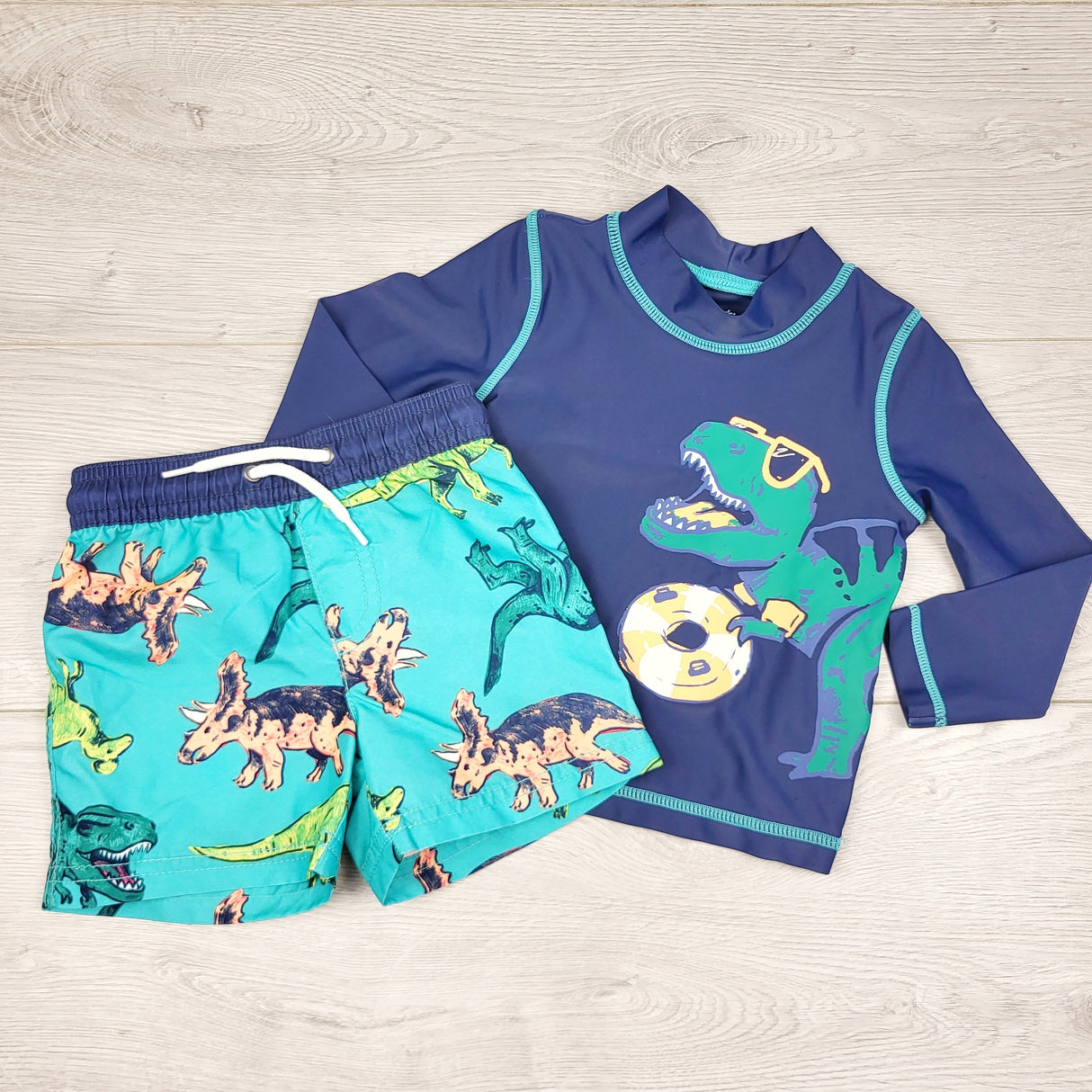 TBOW2 - Carters navy and turquoise 2pc swim set with dinosaurs. Size 9 months