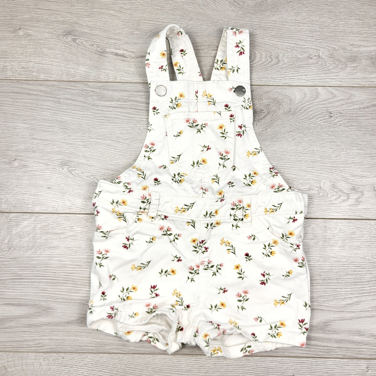 CAAC1 - Children's Place white floral print denim shortalls. Size 2T