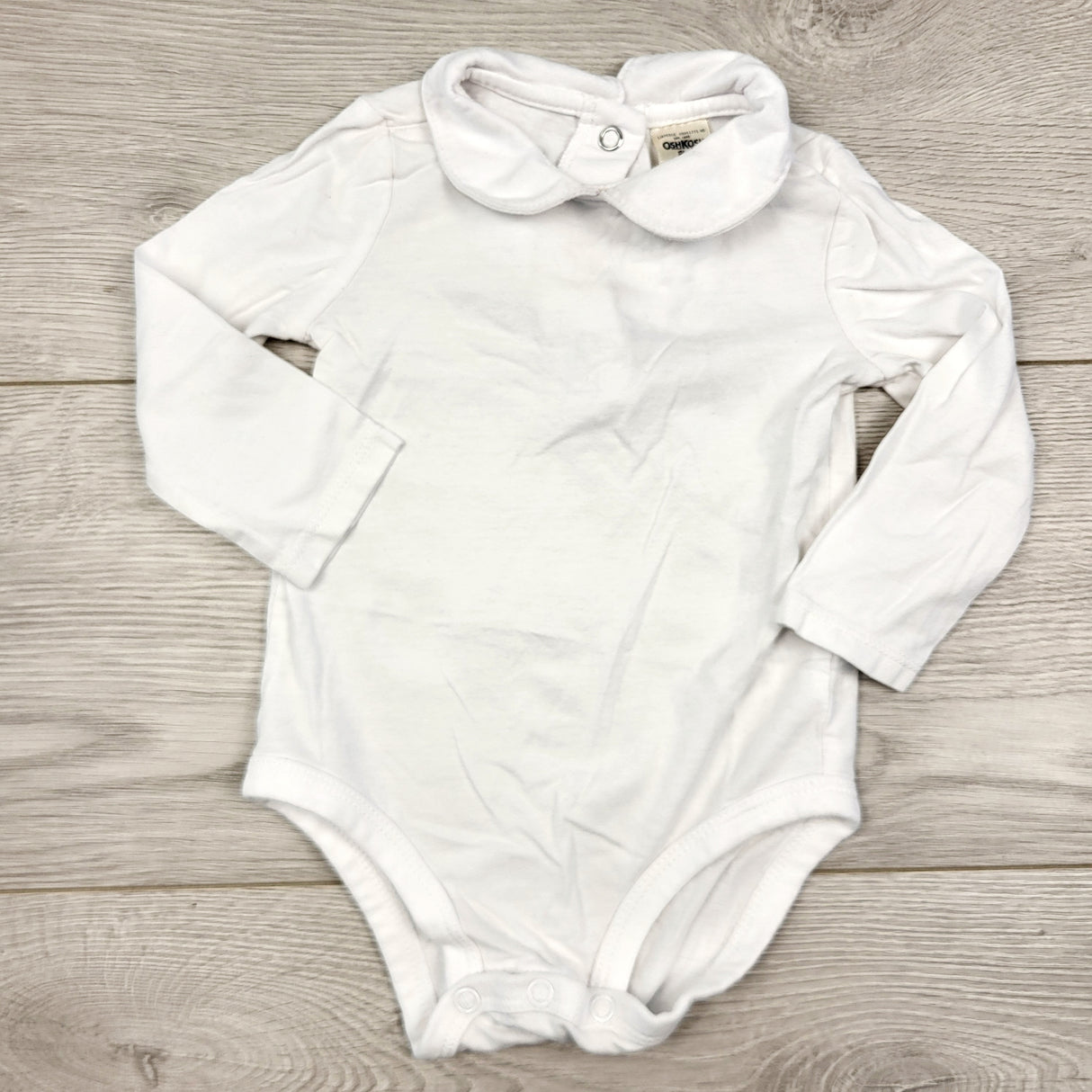 CAAC1 - Oshkosh white collared bodysuit. Size 9 months