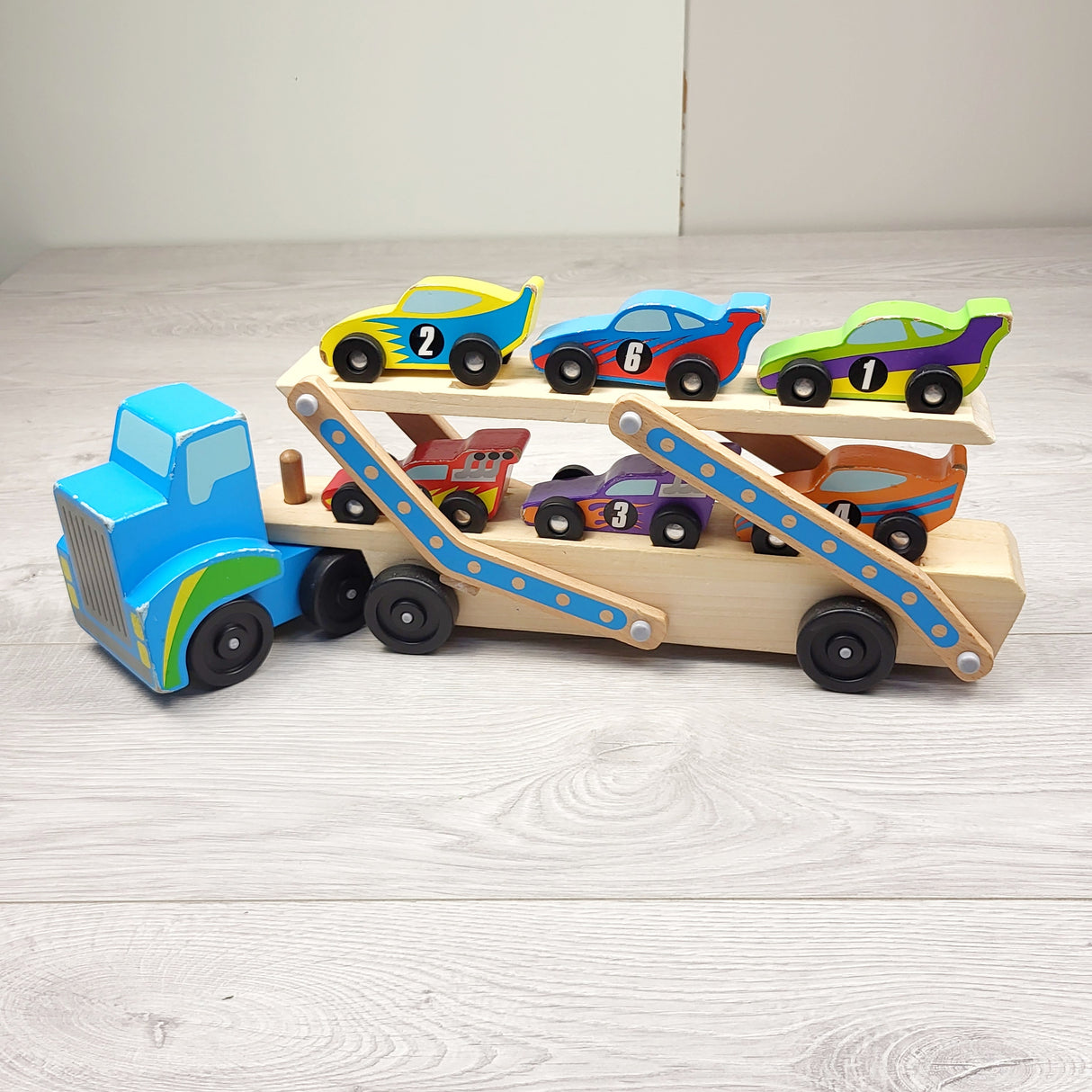 CSMP1 - Melissa and Doug wooden racecar carrier. LOCAL pick up or delivery only