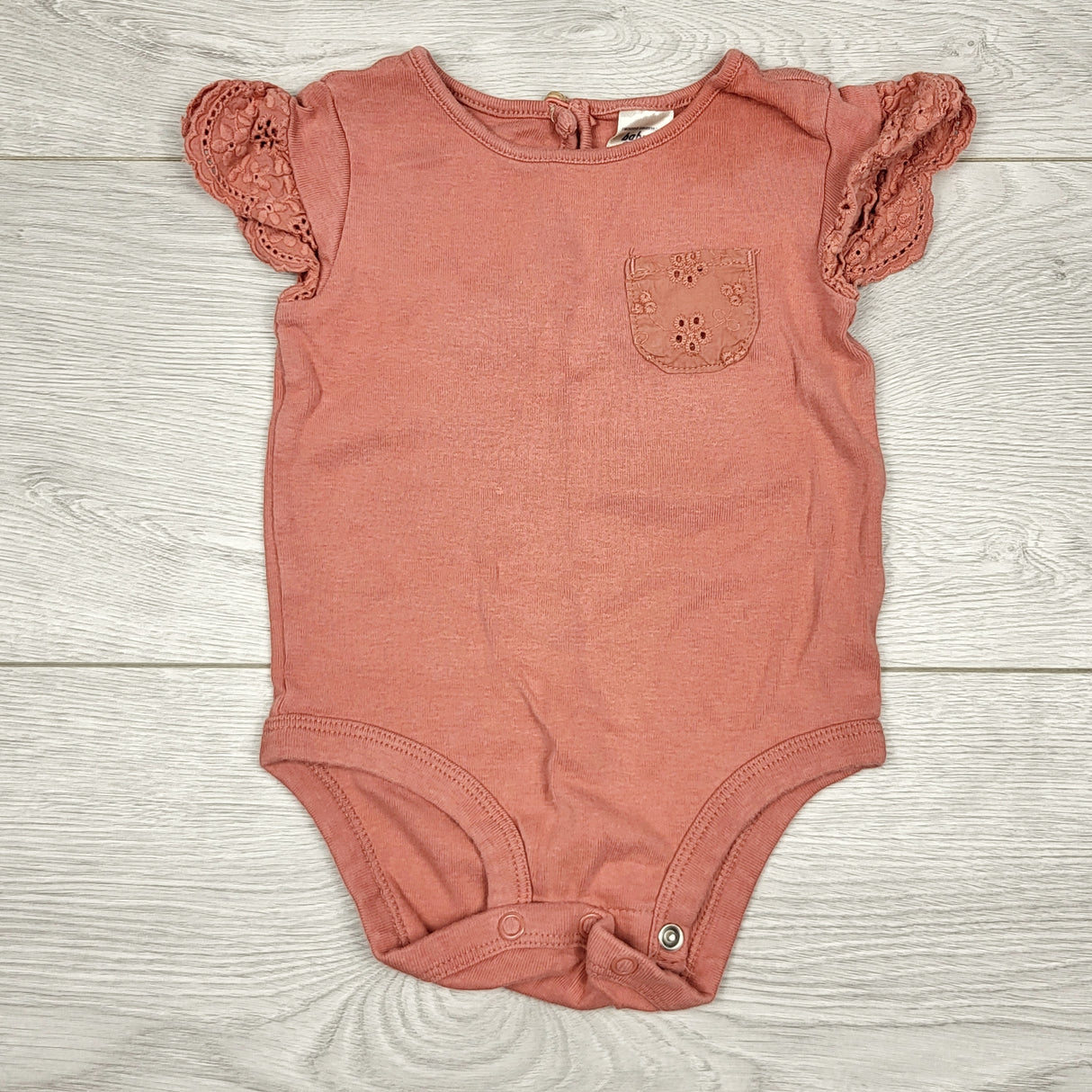 ECRS11 - Oshkosh terracotta bodysuit. Size 6 months
