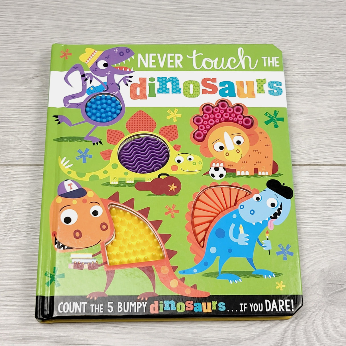 STLL1 - Never Touch the Dinosaurs. Touch and feel board book