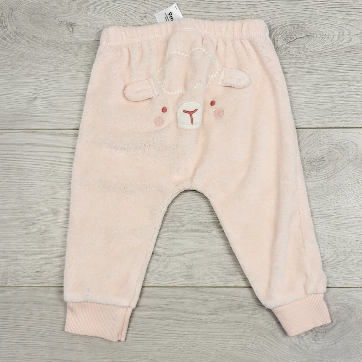 STMA1 - Carters pink terrycloth pants with lamb bum. Size 9 months