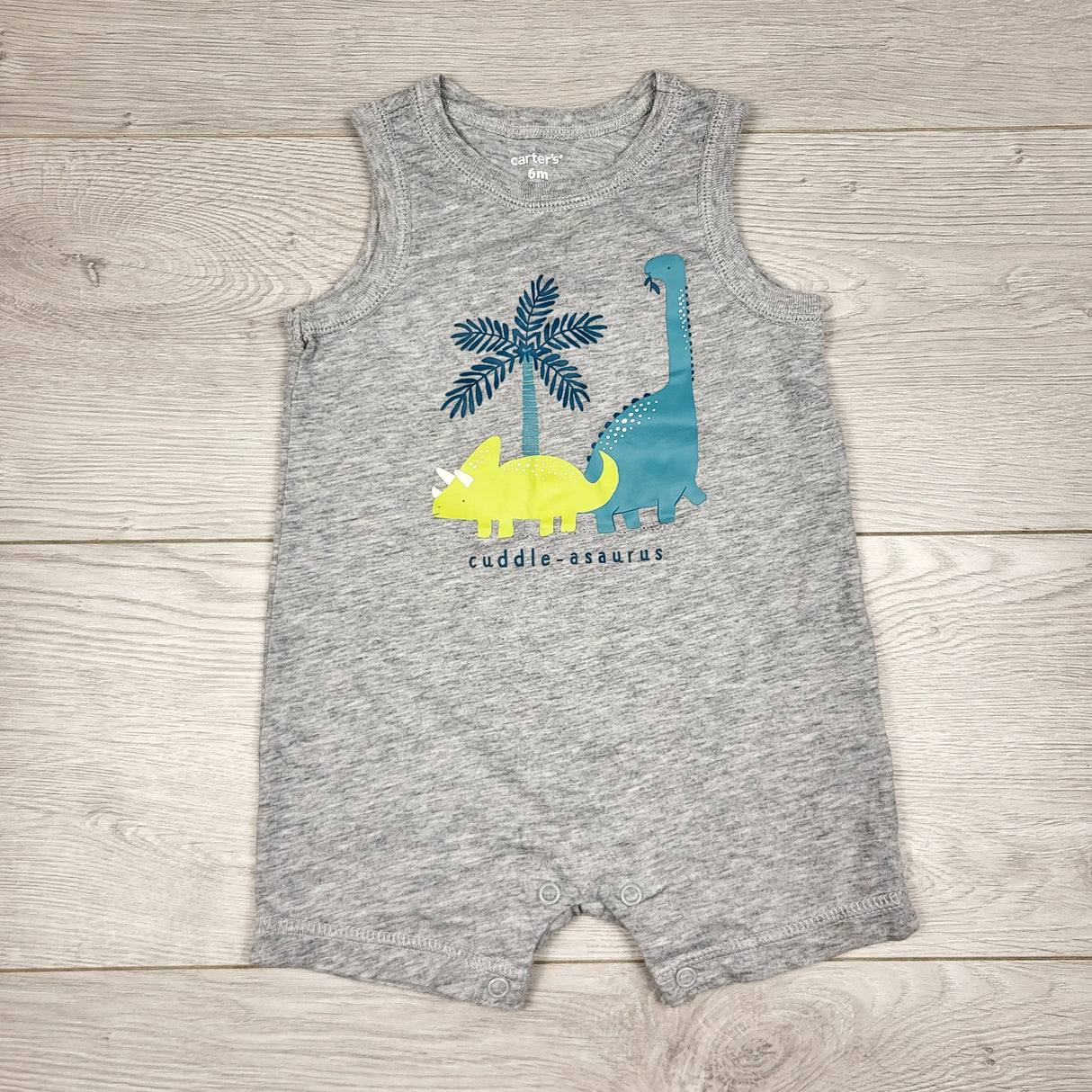 KARE11 - Carters grey cotton romper with dinosaurs. Size 6 months