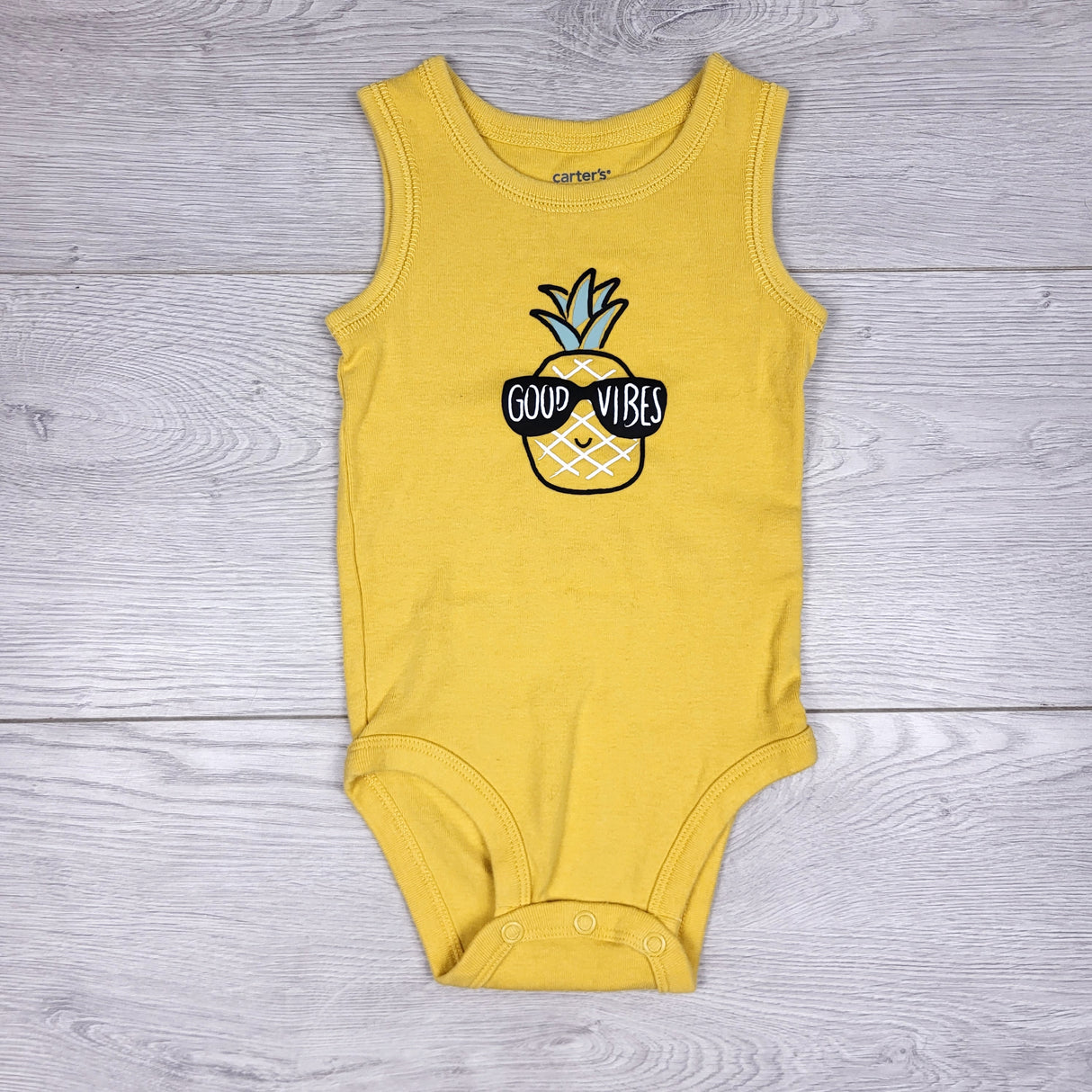 KARE11 - Carters yellow tank style bodysuit with pineapple. Size 6 months