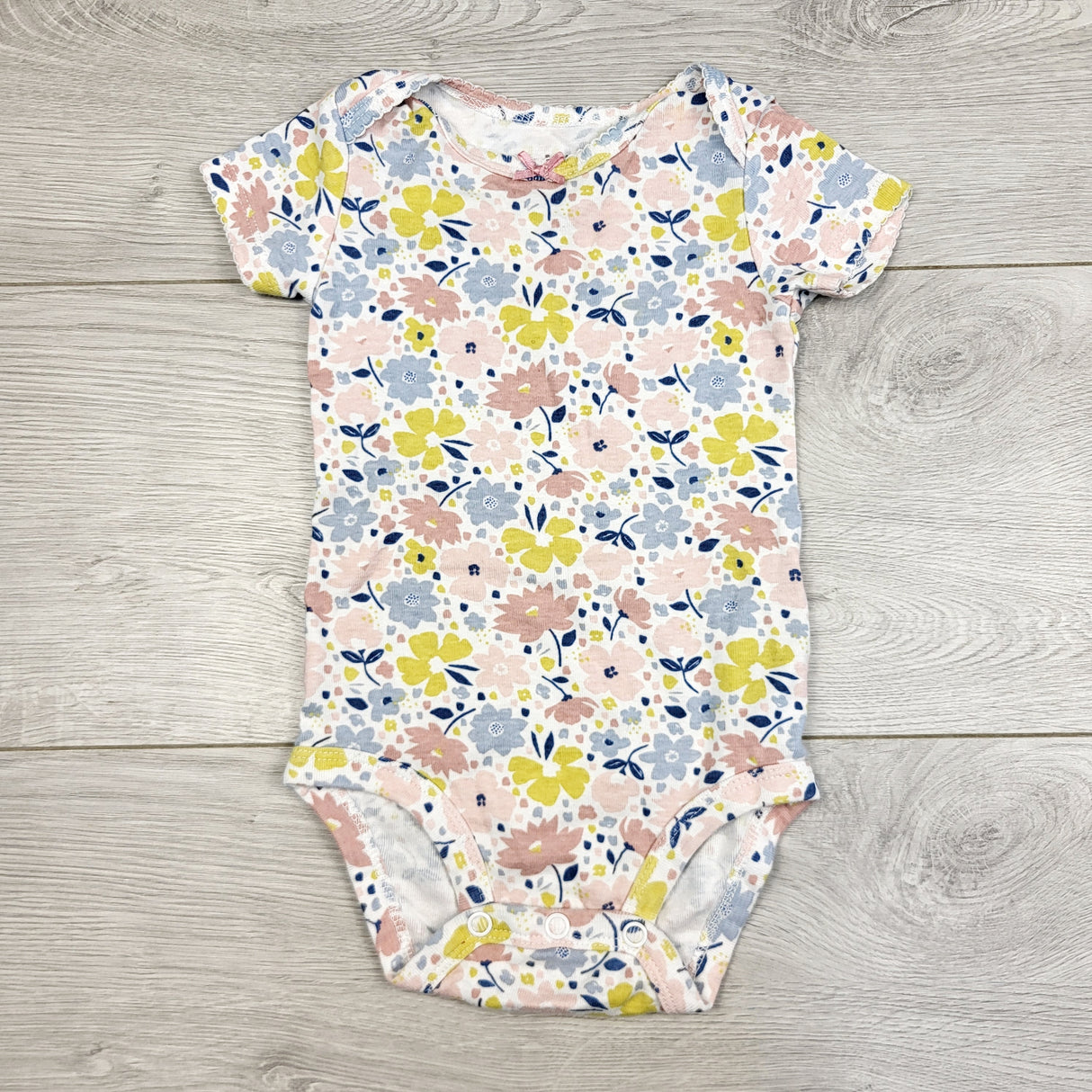 BBIN1 - Child of Mine floral print bodysuit. Size 3-6 months