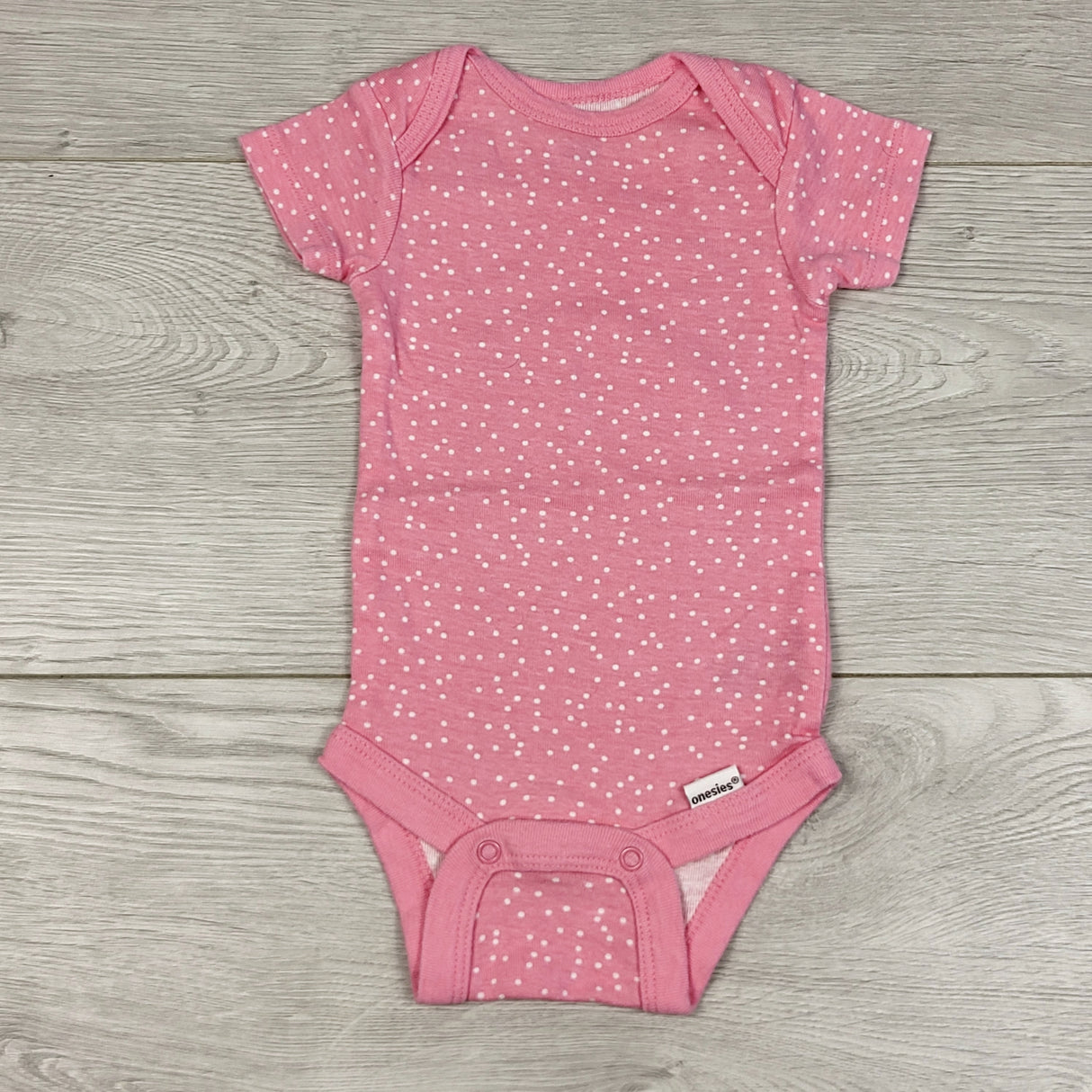 RBEN5 - Onesies brand pink polka dot bodysuit. Size 0-3 months