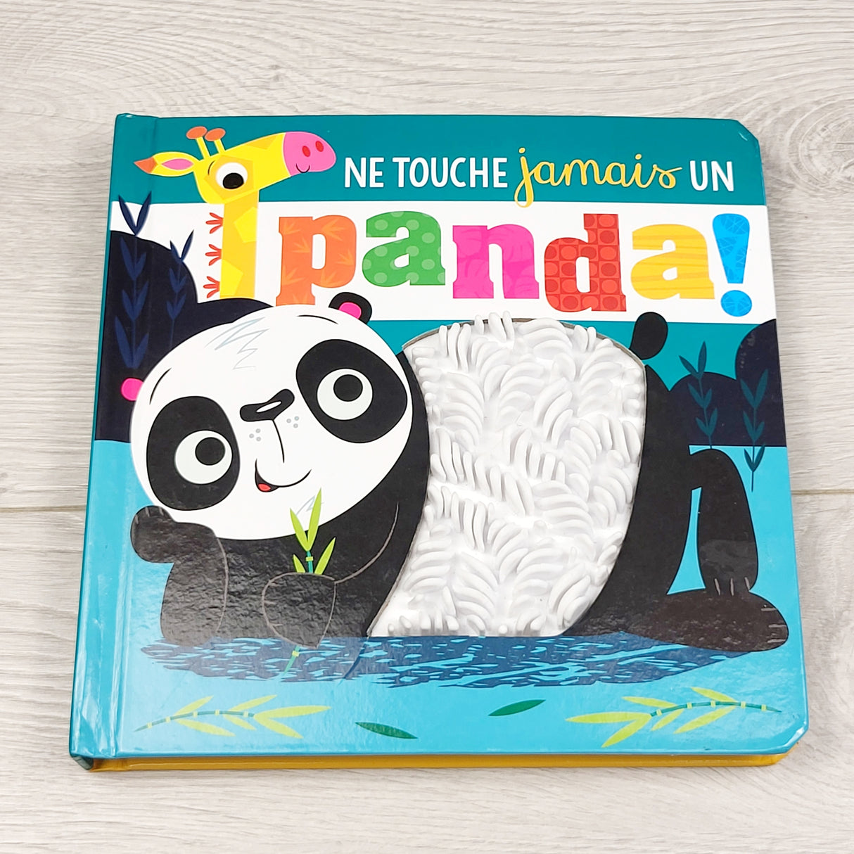 MCX1 - Ne Touche jamais un Panda. French language touch and feel board book