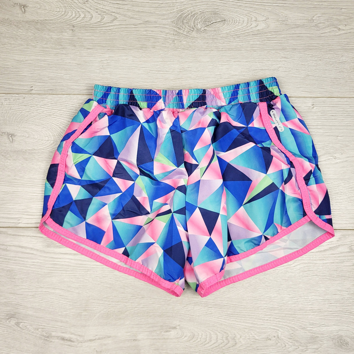 JKZ1 - Delia's Sport blue geometric patterned active shorts. Size 7/8