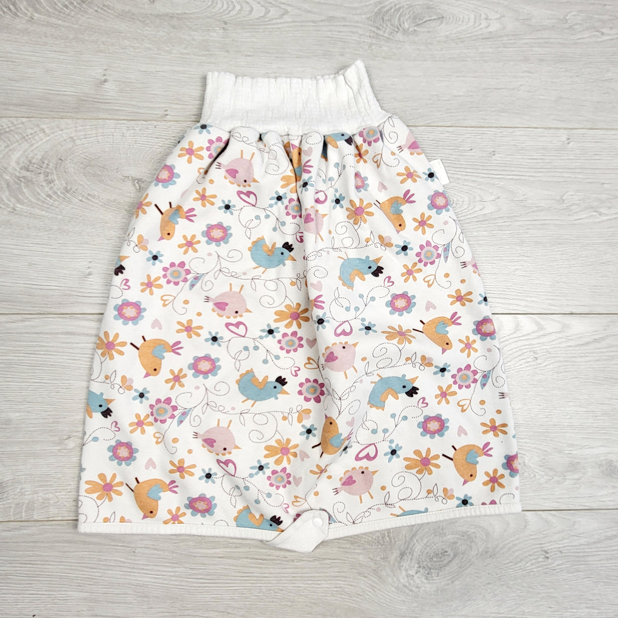 AWAT1 - Pink patterned waterproof diaper pants / skirt. Size large (4 to 8T)